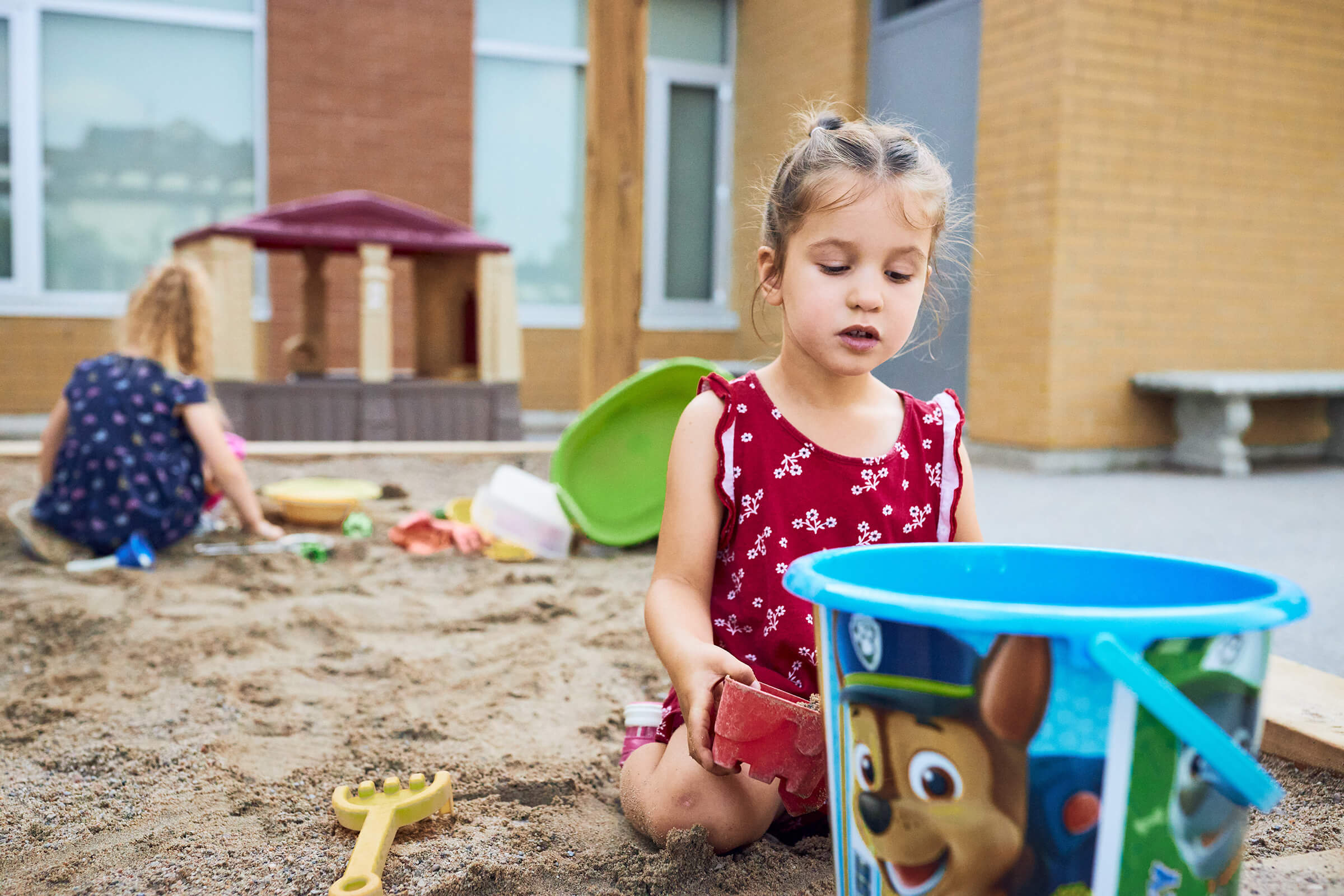 image of children playing in a sandbox